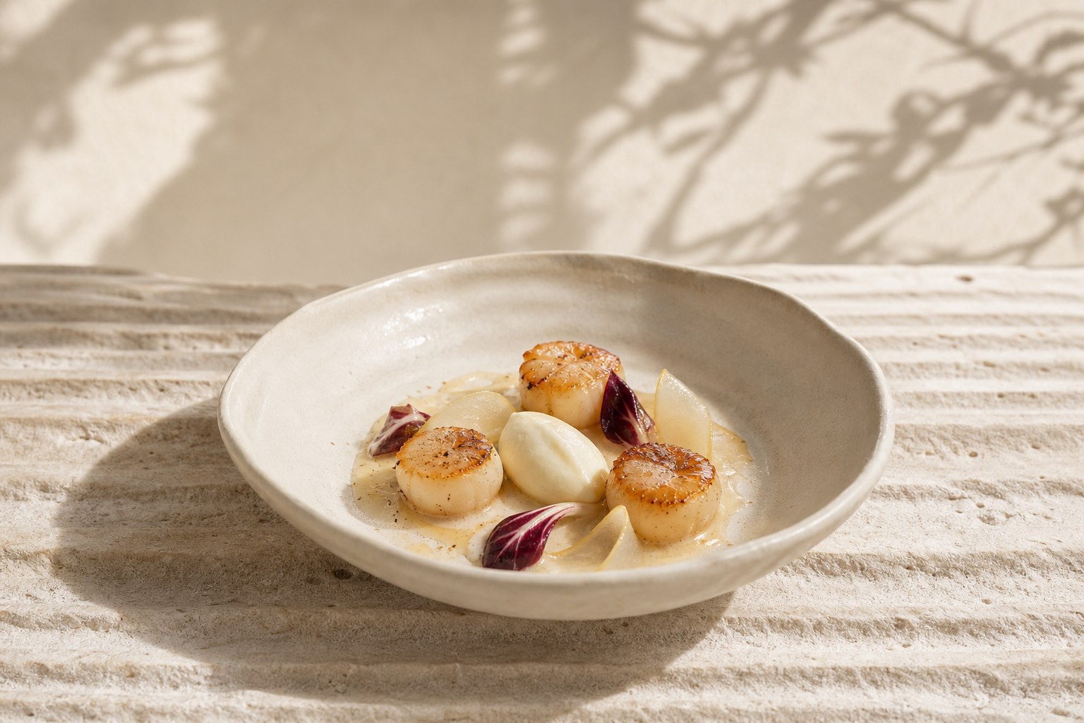 Refined scallop course on pale fluted stone