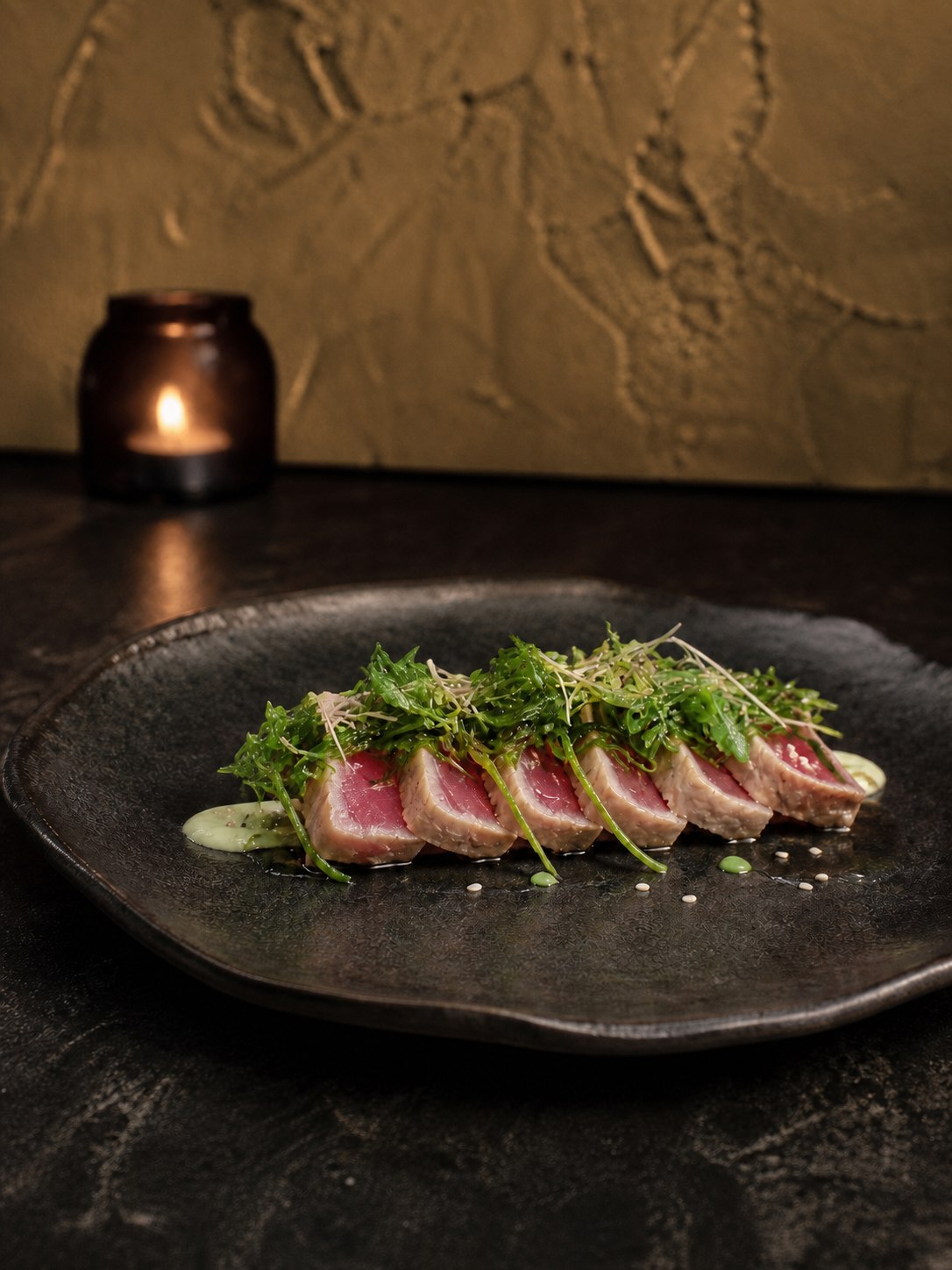Seared tuna winter course against a warm sand backdrop