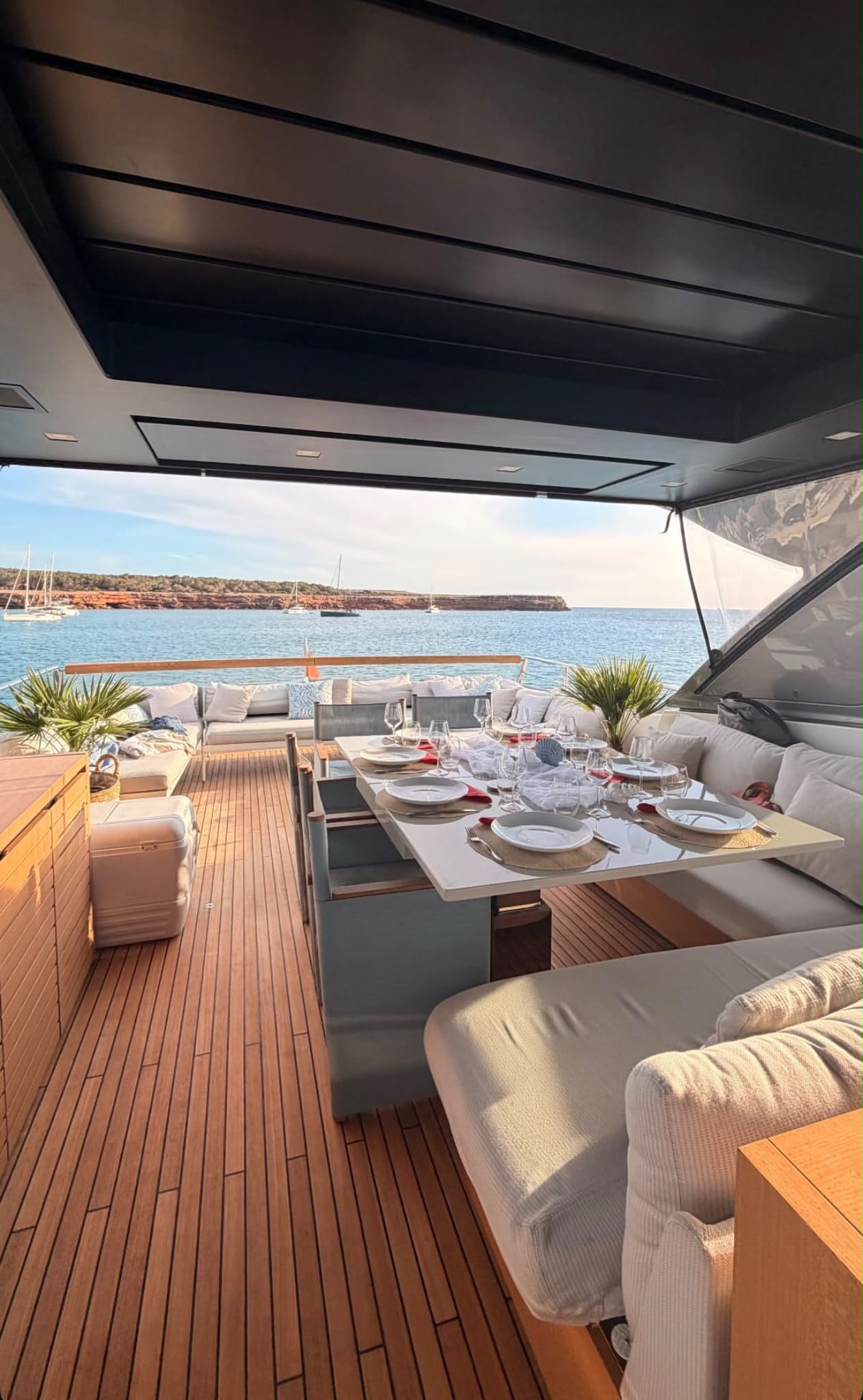 A private yacht dining terrace set beside the sea